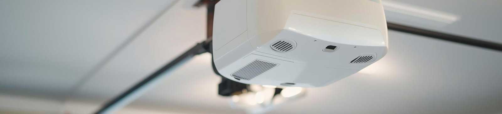 Close-up of a garage door opener system being serviced in a bright, modern Anaheim garage